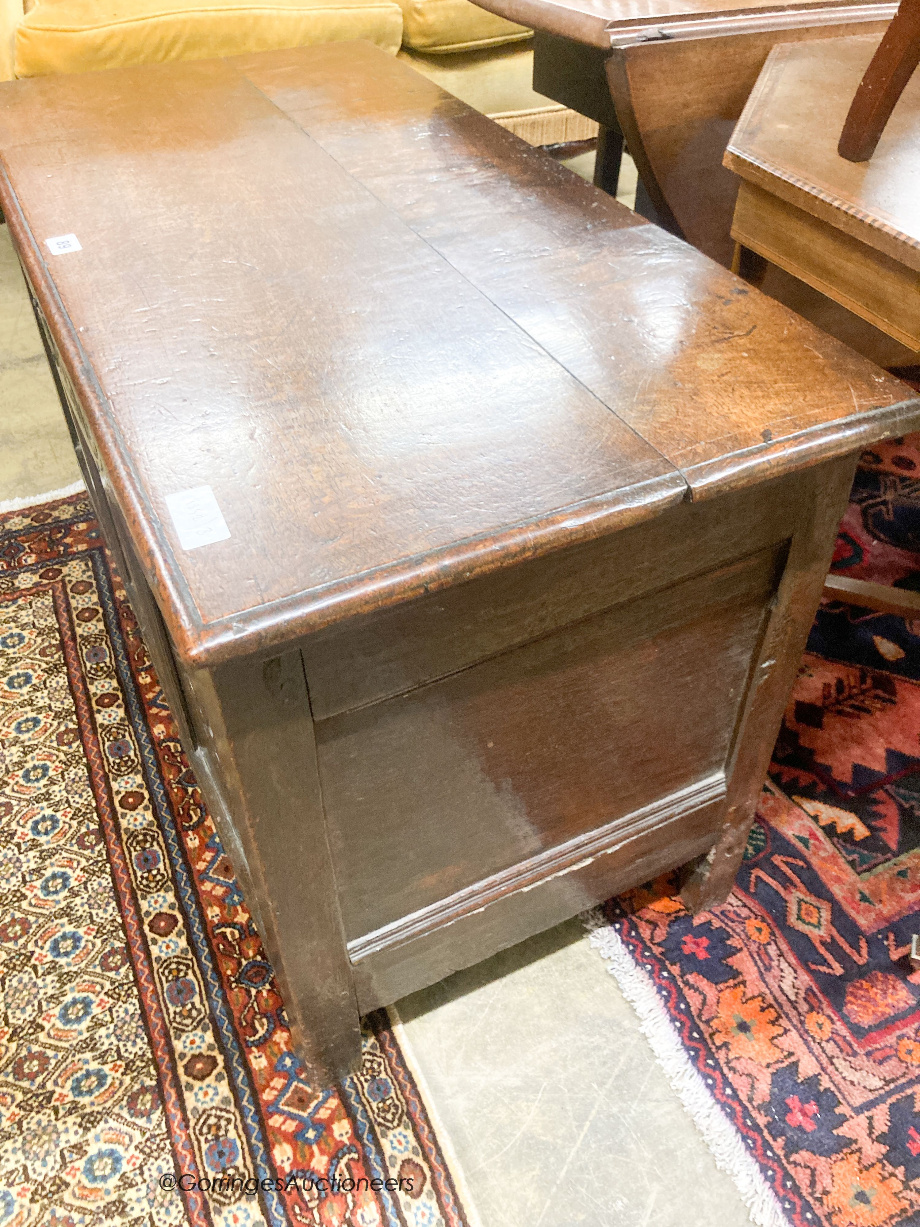 An 18th century carved oak coffer, length 95cm, depth 47cm, height 59cm